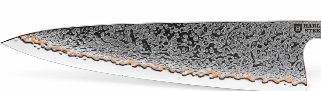 Close-up of Light's blade, showing the 55-layer Damascus pattern and copper detailing along the edge.